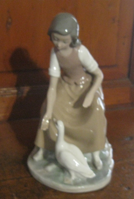 Lladro "Young Girl Feeding Duck" #0744